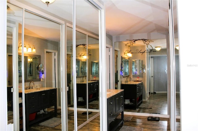 bathroom featuring vanity and wood finished floors