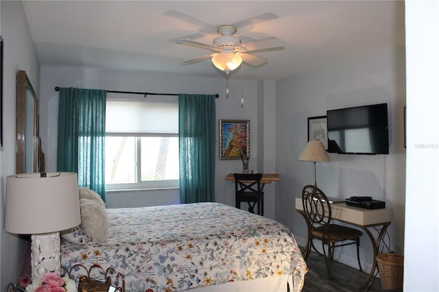 7200 Sunshine Skyway Ln S Unit 2E, Saint Petersburg, FL 33711 - bedroom with baseboards, a ceiling fan, and wood finished floors