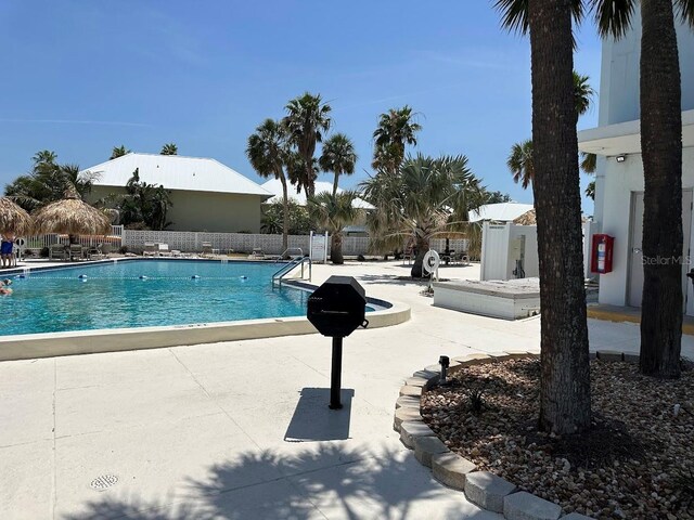 7200 Sunshine Skyway Ln S Unit 2E, Saint Petersburg, FL 33711 - community pool featuring a patio and fence