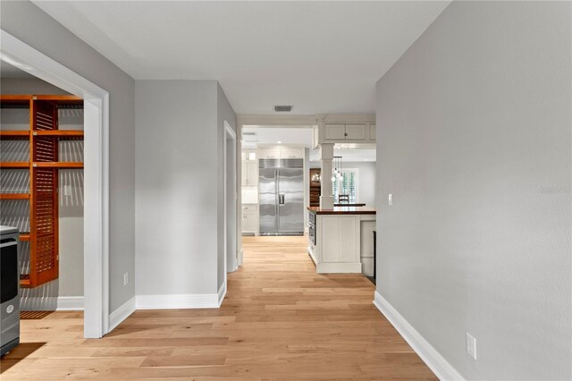 493 Lucerne Ave, Tampa, FL 33606 - corridor featuring light wood finished floors and baseboards