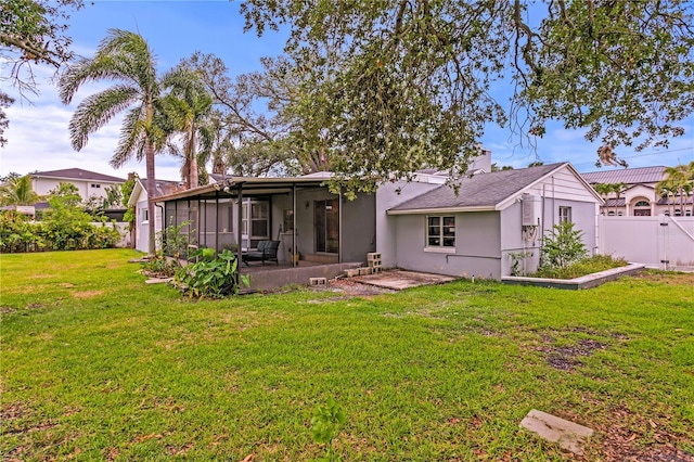 493 Lucerne Ave, Tampa, FL 33606 - rear view of house featuring a sunroom and a patio area