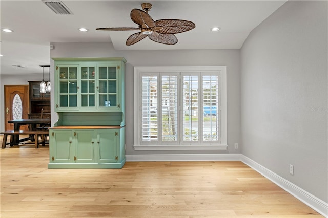 493 Lucerne Ave, Tampa, FL 33606 - unfurnished living room featuring ceiling fan, baseboards, recessed lighting, and light wood-type flooring