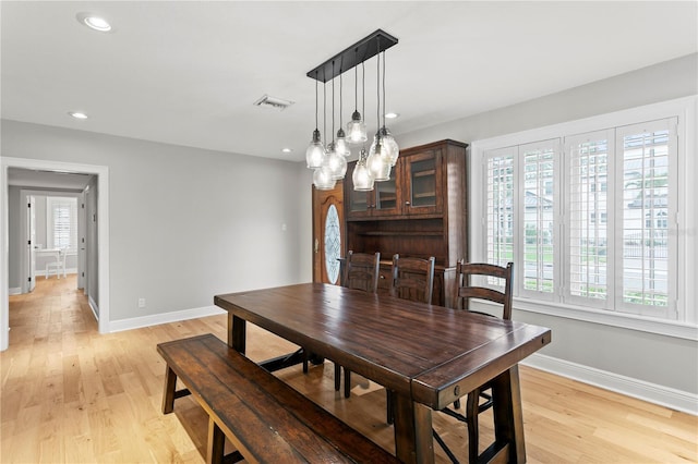 493 Lucerne Ave, Tampa, FL 33606 - dining area featuring baseboards, light wood-style flooring, recessed lighting, and a chandelier