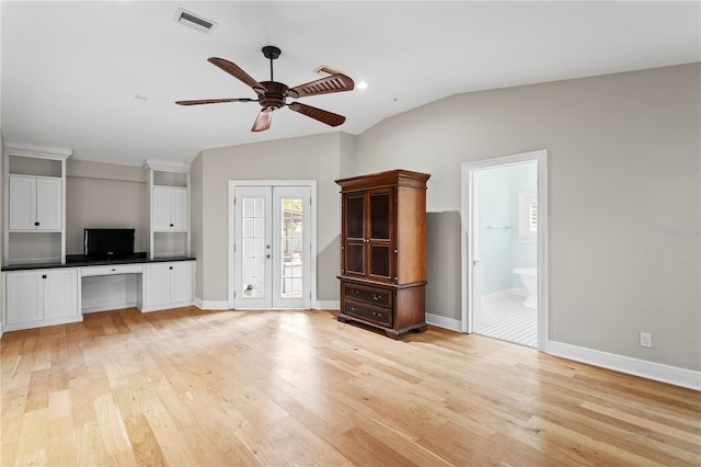 493 Lucerne Ave, Tampa, FL 33606 - unfurnished living room with lofted ceiling, ceiling fan, light wood-type flooring, and baseboards
