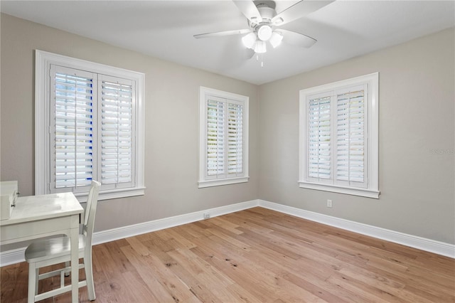 493 Lucerne Ave, Tampa, FL 33606 - unfurnished office with light wood finished floors, a ceiling fan, and baseboards