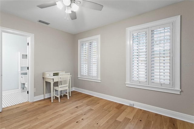 493 Lucerne Ave, Tampa, FL 33606 - office area featuring light wood-type flooring, ceiling fan, and baseboards
