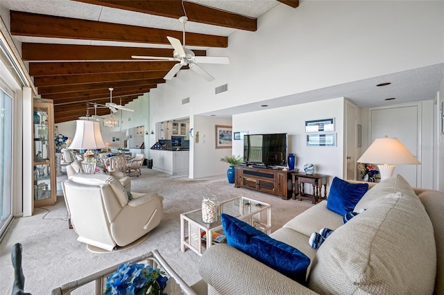 1351 Gulf Blvd Unit 209, Clearwater Beach, FL 33767 - carpeted living room featuring a ceiling fan, beam ceiling, and high vaulted ceiling