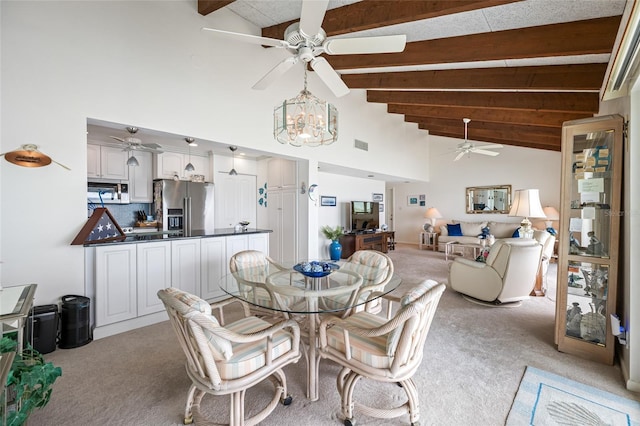 1351 Gulf Blvd Unit 209, Clearwater Beach, FL 33767 - dining space featuring ceiling fan, light carpet, beamed ceiling, high vaulted ceiling, and a chandelier