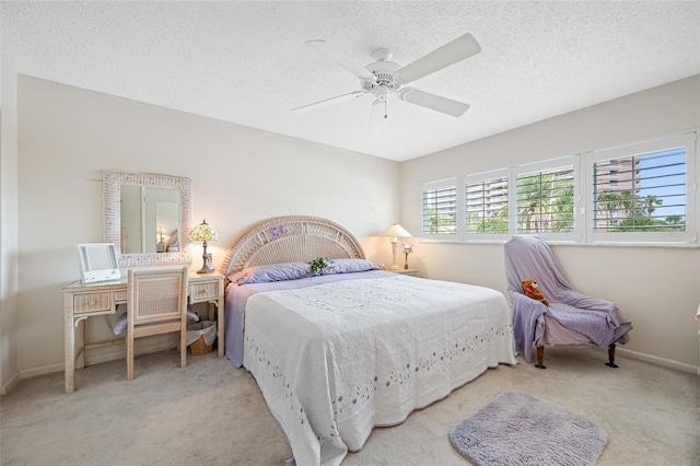1351 Gulf Blvd Unit 209, Clearwater Beach, FL 33767 - carpeted bedroom featuring a textured ceiling, baseboards, and a ceiling fan