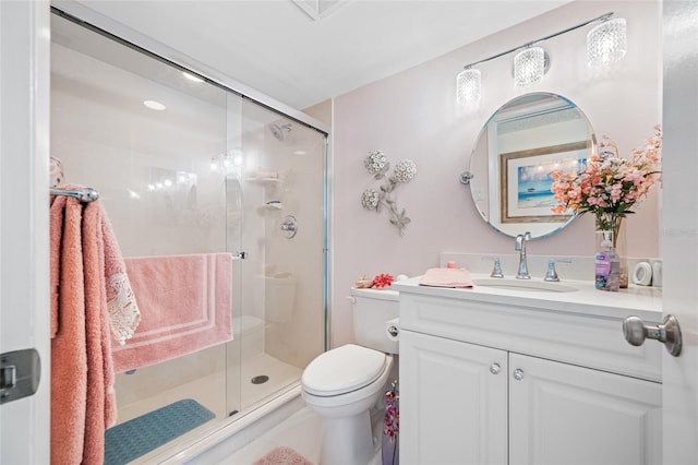 1351 Gulf Blvd Unit 209, Clearwater Beach, FL 33767 - bathroom featuring a stall shower, toilet, and vanity