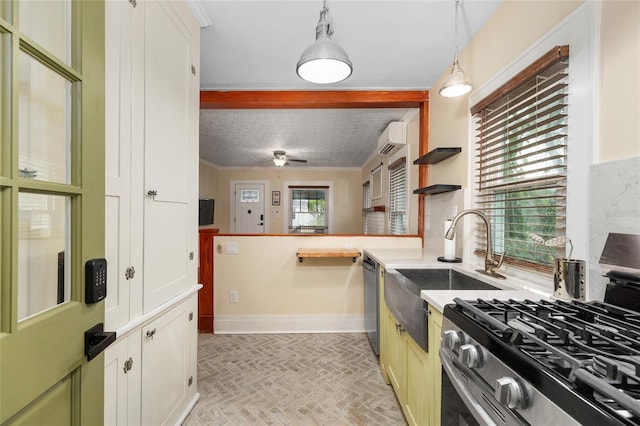 931 28th Ave N, Saint Petersburg, FL 33704 - kitchen with appliances with stainless steel finishes, a sink, brick patterned floors, an AC wall unit, and baseboards