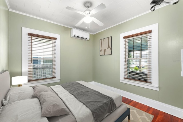 931 28th Ave N, Saint Petersburg, FL 33704 - bedroom with an AC wall unit, ornamental molding, multiple windows, wood finished floors, and baseboards
