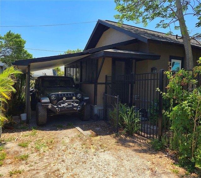 931 28th Ave N, Saint Petersburg, FL 33704 - view of side of property with a carport