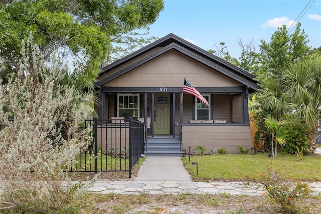931 28th Ave N, Saint Petersburg, FL 33704 - shotgun-style home with covered porch