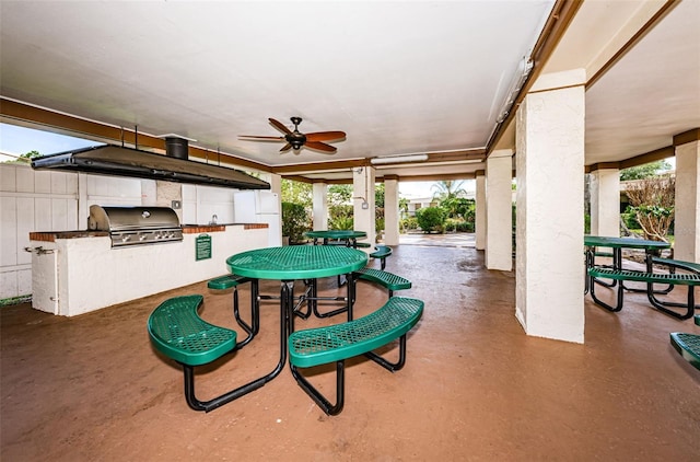 view of patio featuring grilling area, an outdoor kitchen, and a ceiling fan