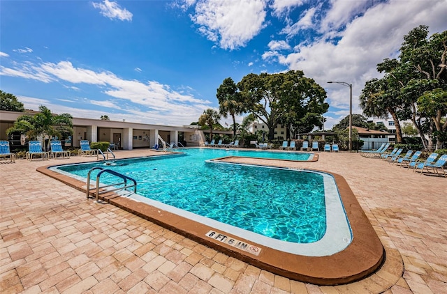community pool featuring a patio area