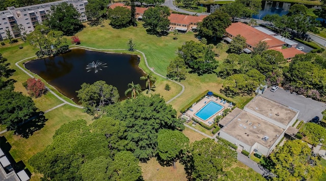 aerial overview of property's location with a large body of water and a pool area