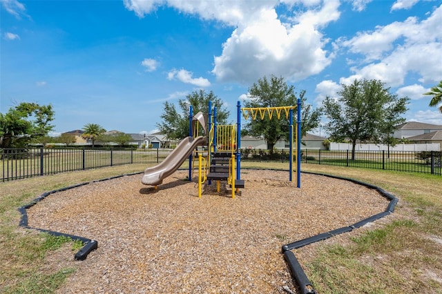 community jungle gym featuring fence