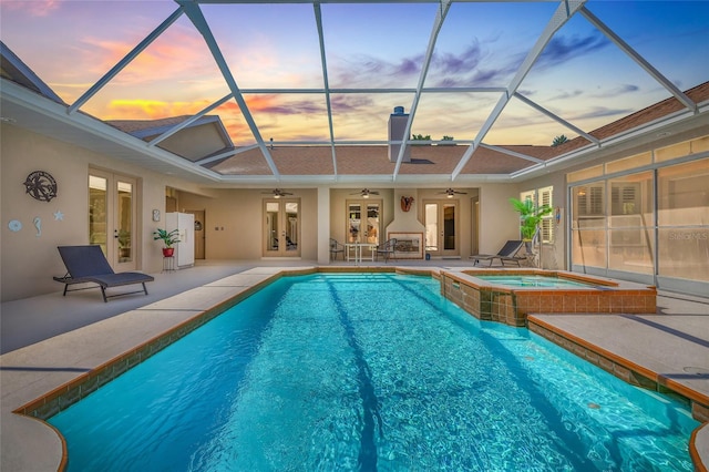 7206 River Country Dr, Weeki Wachee, FL 34607 - view of pool featuring french doors, a ceiling fan, a patio, and a lanai