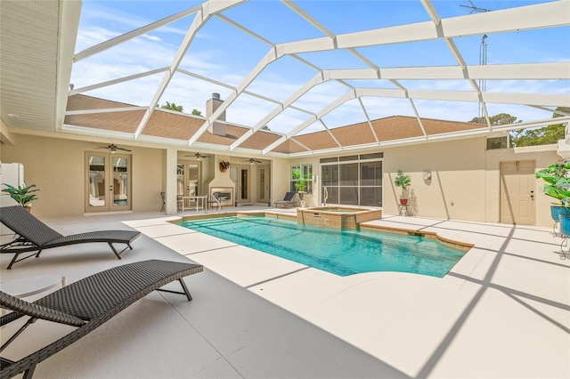 7206 River Country Dr, Weeki Wachee, FL 34607 - view of pool featuring ceiling fan, french doors, a patio area, and a pool with connected hot tub