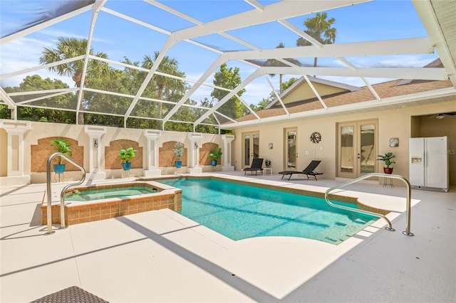 7206 River Country Dr, Weeki Wachee, FL 34607 - view of swimming pool featuring a patio, french doors, glass enclosure, and a pool with connected hot tub