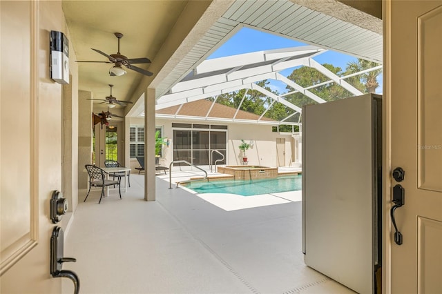 7206 River Country Dr, Weeki Wachee, FL 34607 - view of pool with a ceiling fan, a patio, a pool with connected hot tub, and glass enclosure