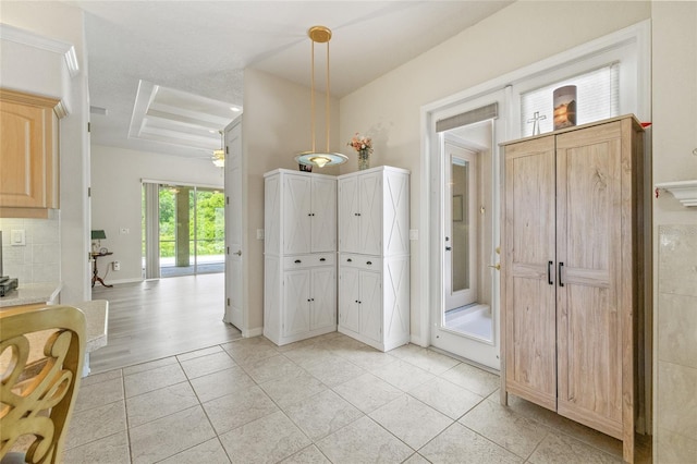 7206 River Country Dr, Weeki Wachee, FL 34607 - entrance foyer with a raised ceiling, light tile patterned flooring, and a ceiling fan