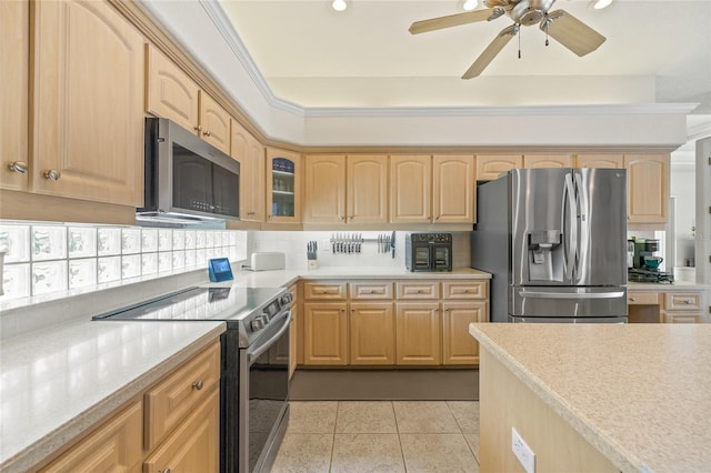 7206 River Country Dr, Weeki Wachee, FL 34607 - kitchen featuring stainless steel appliances, light brown cabinets, light countertops, and recessed lighting