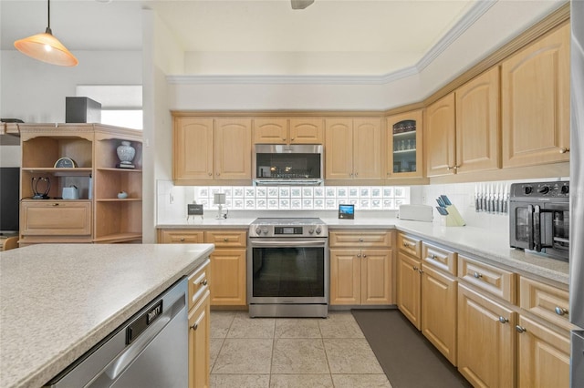 7206 River Country Dr, Weeki Wachee, FL 34607 - kitchen with appliances with stainless steel finishes, light brown cabinets, light countertops, and backsplash