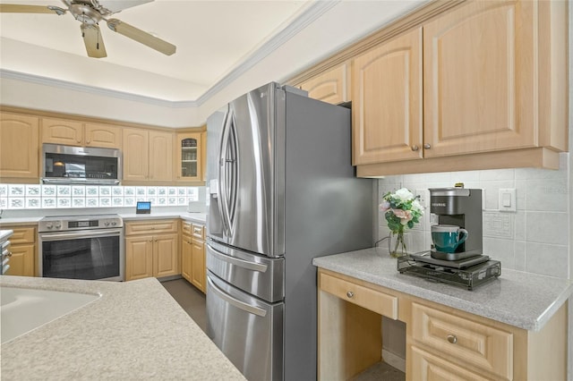 7206 River Country Dr, Weeki Wachee, FL 34607 - kitchen featuring appliances with stainless steel finishes, light brown cabinets, and backsplash