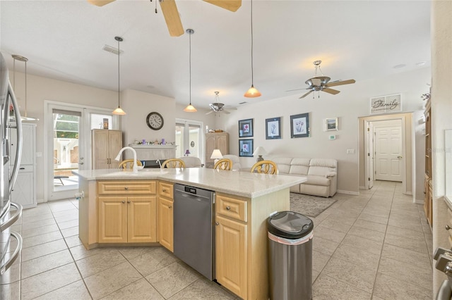 7206 River Country Dr, Weeki Wachee, FL 34607 - kitchen with ceiling fan, appliances with stainless steel finishes, light brown cabinets, light tile patterned flooring, and open floor plan