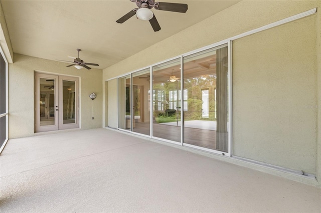 7206 River Country Dr, Weeki Wachee, FL 34607 - unfurnished sunroom with a ceiling fan and french doors