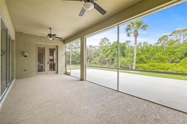 7206 River Country Dr, Weeki Wachee, FL 34607 - unfurnished sunroom with a ceiling fan and french doors