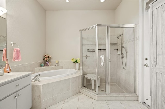 7206 River Country Dr, Weeki Wachee, FL 34607 - bathroom featuring a garden tub, a stall shower, vanity, tile patterned floors, and recessed lighting