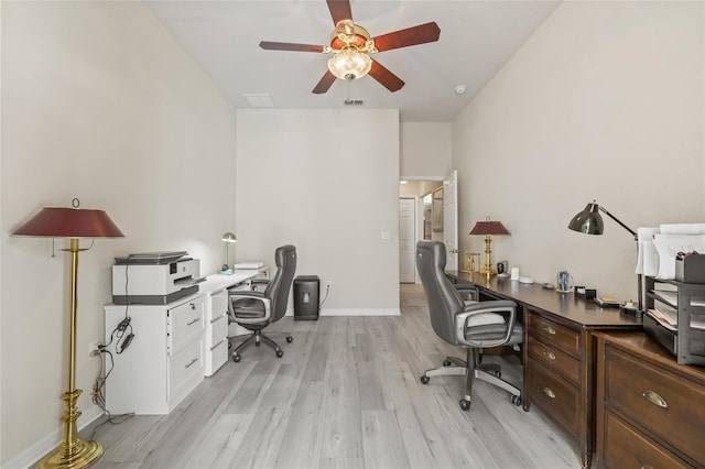 7206 River Country Dr, Weeki Wachee, FL 34607 - office space featuring a ceiling fan, light wood-type flooring, baseboards, and lofted ceiling