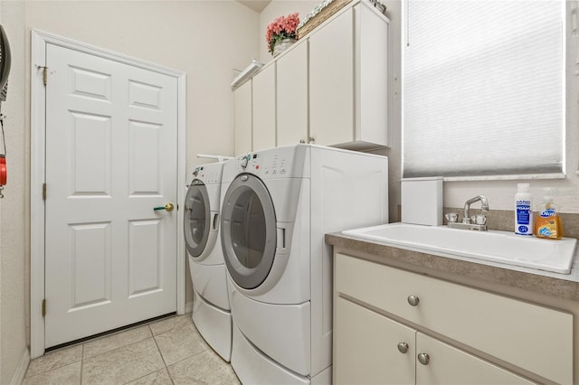 7206 River Country Dr, Weeki Wachee, FL 34607 - laundry area with washer and clothes dryer, cabinet space, and light tile patterned floors