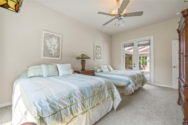 7206 River Country Dr, Weeki Wachee, FL 34607 - bedroom featuring french doors, access to outside, light colored carpet, and baseboards