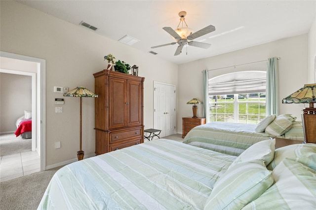 7206 River Country Dr, Weeki Wachee, FL 34607 - bedroom with light carpet, baseboards, light tile patterned floors, ceiling fan, and access to outside