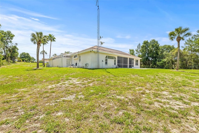 7206 River Country Dr, Weeki Wachee, FL 34607 - view of grassy yard with a sunroom
