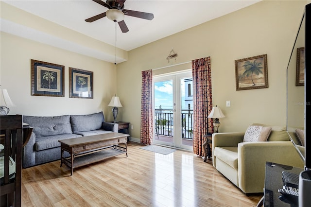 13235 Gulf Blvd Unit 402, Saint Petersburg, FL 33708 - living room featuring a ceiling fan, light wood finished floors, and baseboards