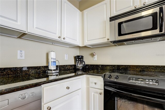 13235 Gulf Blvd Unit 402, Saint Petersburg, FL 33708 - kitchen featuring stainless steel appliances and white cabinetry