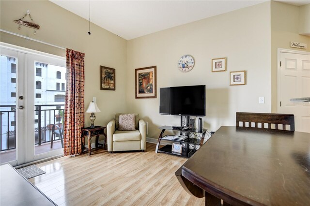 13235 Gulf Blvd Unit 402, Saint Petersburg, FL 33708 - living room featuring light wood finished floors, french doors, and baseboards