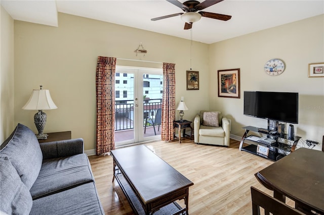 13235 Gulf Blvd Unit 402, Saint Petersburg, FL 33708 - living room with french doors, a ceiling fan, light wood-style floors, and baseboards