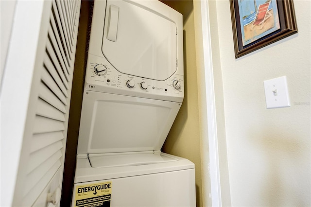 13235 Gulf Blvd Unit 402, Saint Petersburg, FL 33708 - laundry room with stacked washer / drying machine