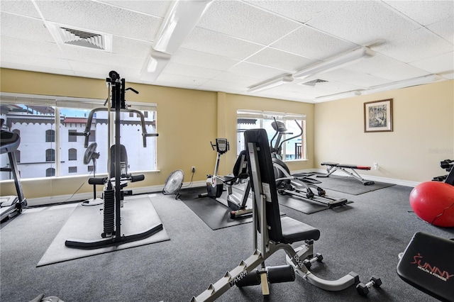 13235 Gulf Blvd Unit 402, Saint Petersburg, FL 33708 - exercise room featuring a paneled ceiling, baseboards, and healthy amount of natural light