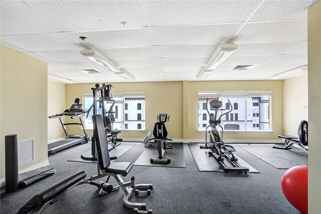 13235 Gulf Blvd Unit 402, Saint Petersburg, FL 33708 - workout area featuring a paneled ceiling and baseboards