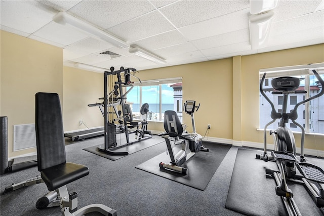 13235 Gulf Blvd Unit 402, Saint Petersburg, FL 33708 - workout area with a paneled ceiling and baseboards