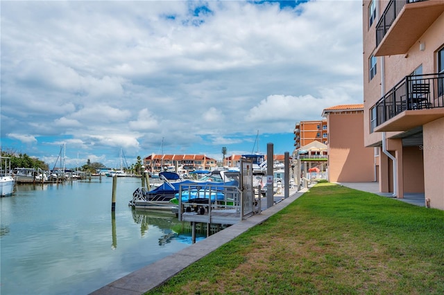 13235 Gulf Blvd Unit 402, Saint Petersburg, FL 33708 - dock area featuring a lawn and a water view
