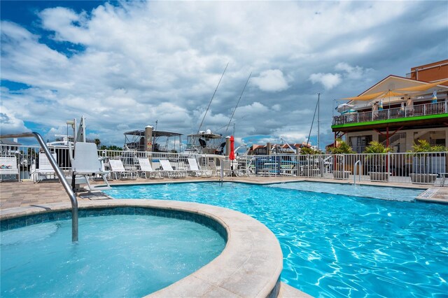 13235 Gulf Blvd Unit 402, Saint Petersburg, FL 33708 - community pool featuring fence and a patio