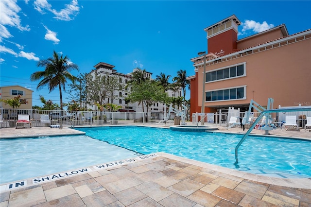 13235 Gulf Blvd Unit 402, Saint Petersburg, FL 33708 - community pool with fence and a patio